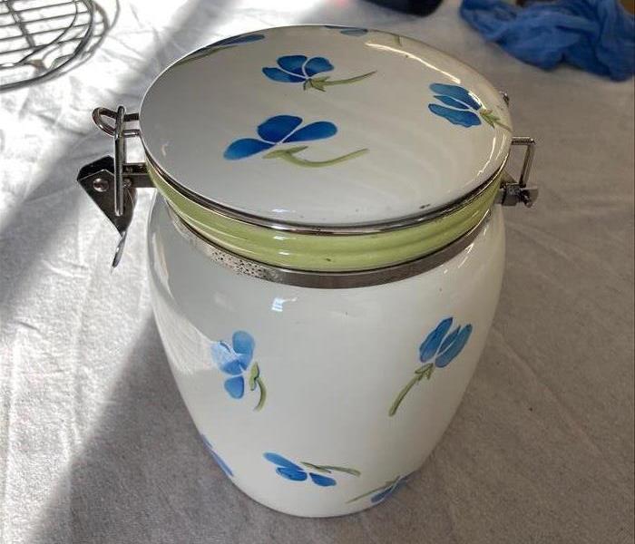 Ceramic jar clean and like new following a thorough cleaning.