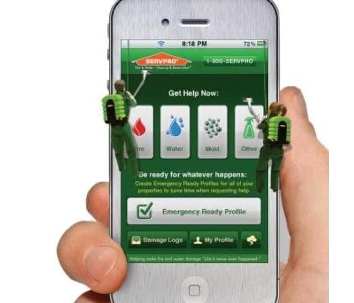 Hand holding a smartphone with the SERVPRO Ready App open.