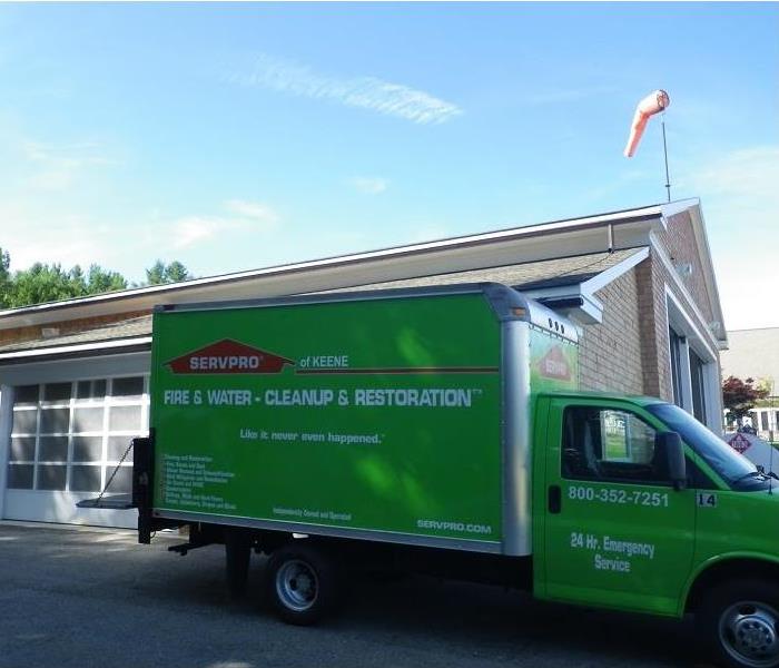 SERVPRO box truck parked on location at a commercial property.
