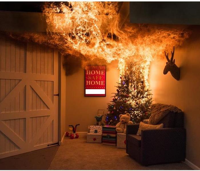 A living room with a Christmas tree that is on fire