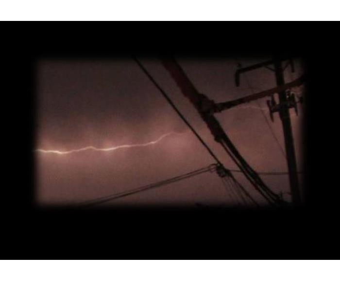 power lines, white bolt of lightning in the distance, soft edges on photo with black background